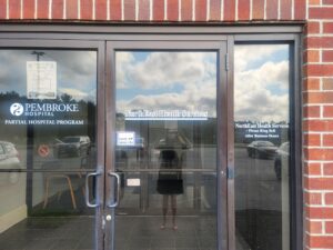 NEHS signage front entry glass doors