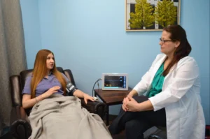 Dr Oxley with Patient